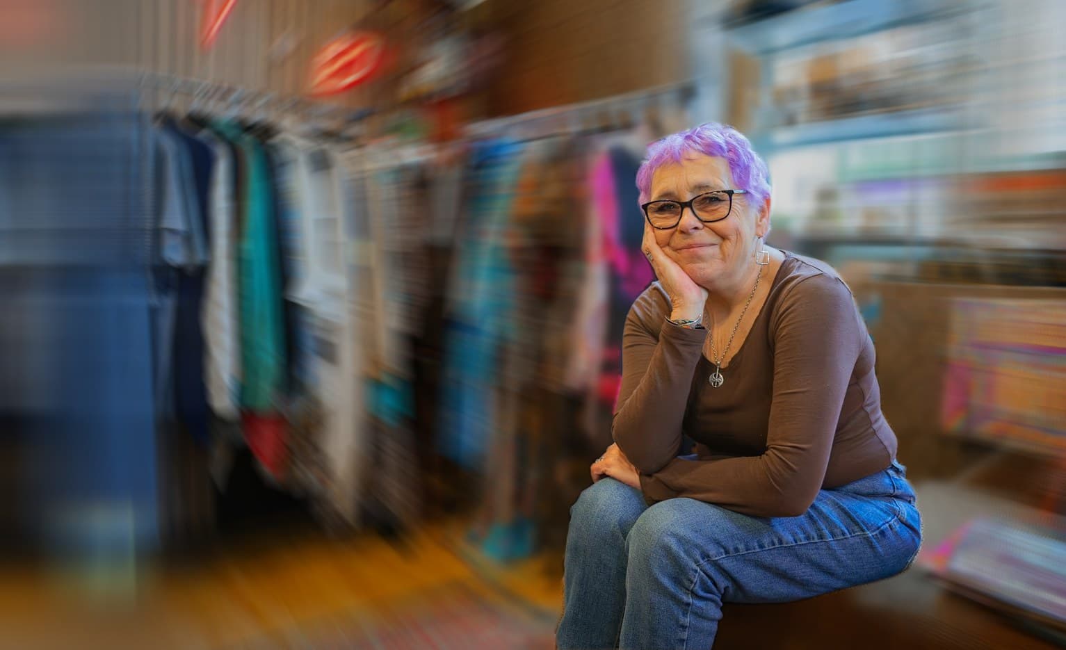An owner behind the counter during a rush