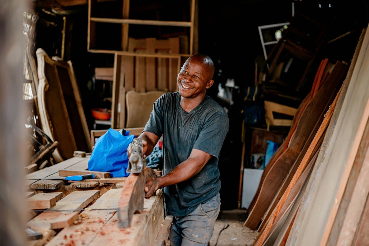 A carpenter cutting boards in his workshop